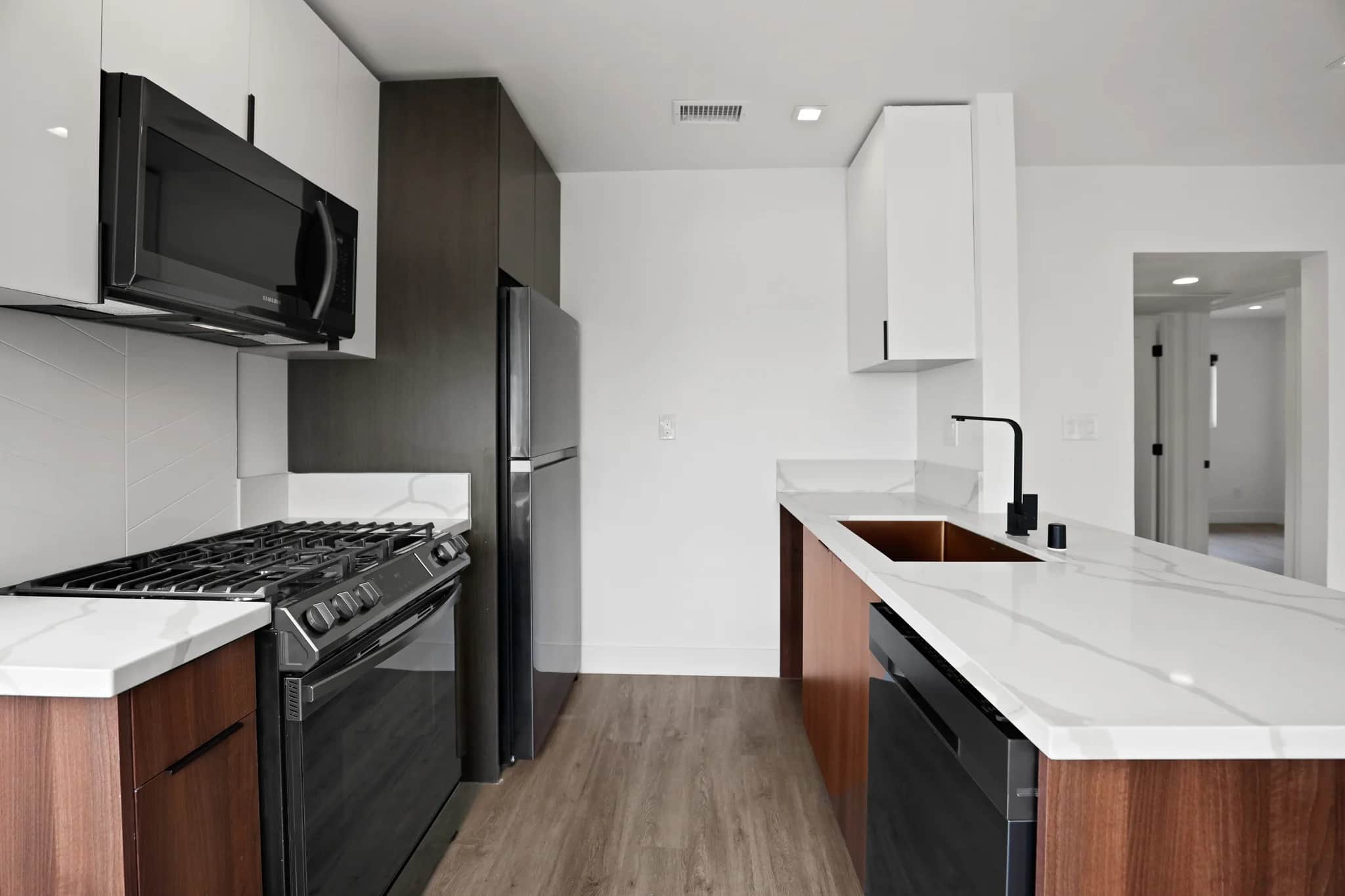 Modern kitchen featuring stainless steel appliances and granite countertops. (photo 1 of 23)