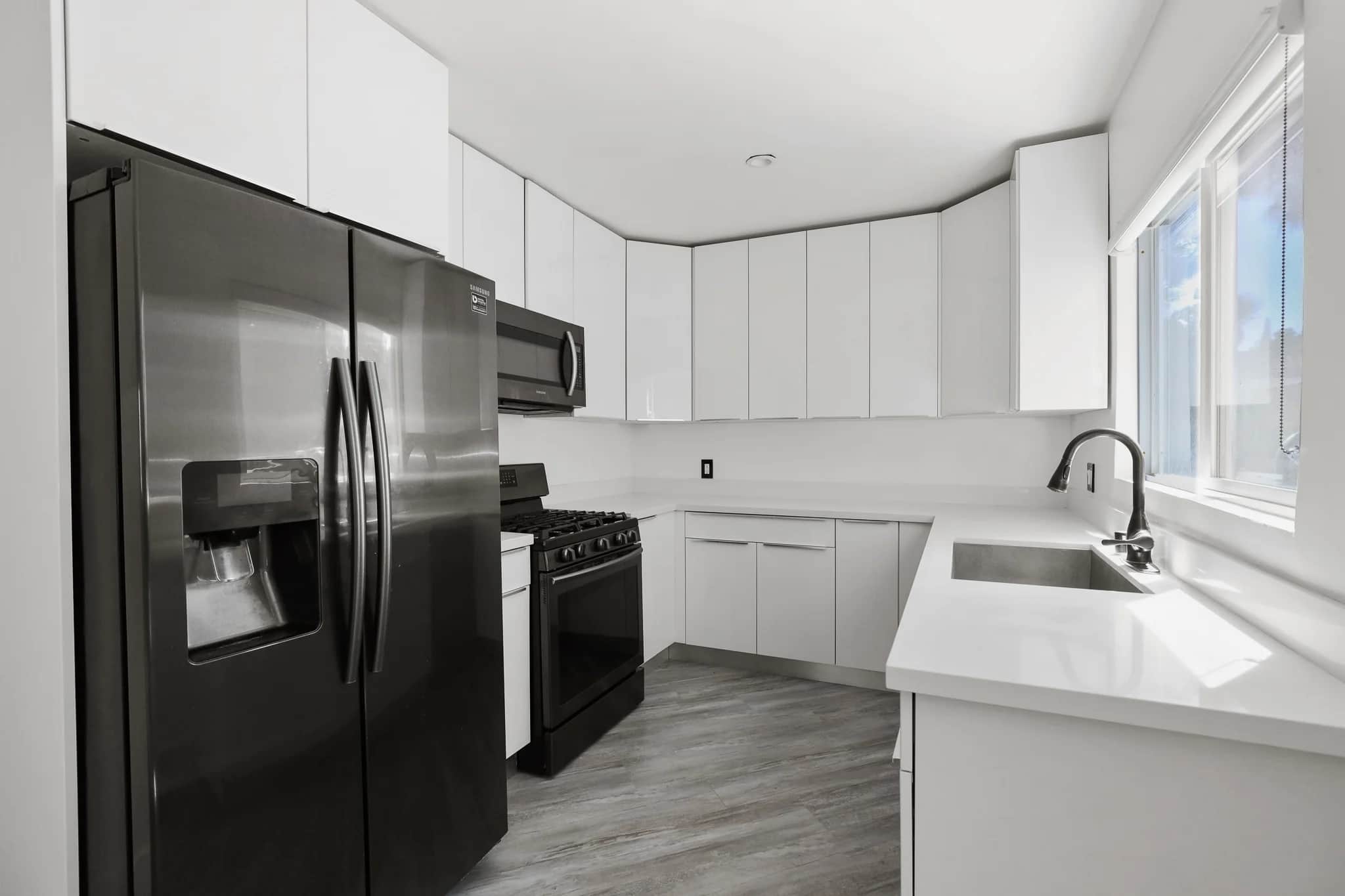 Modern kitchen with stainless appliances and granite countertops. (photo 1 of 25)