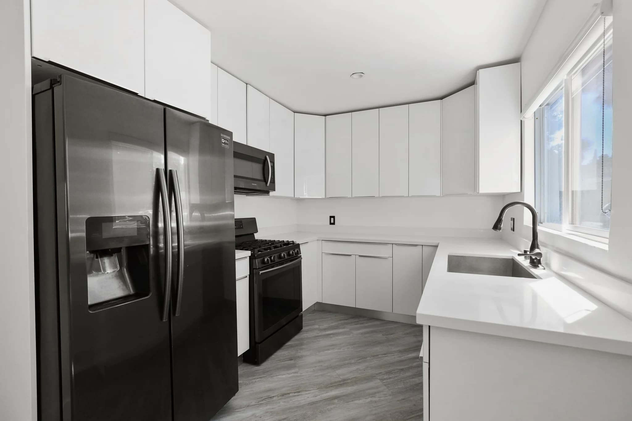 Modern kitchen with stainless appliances and granite countertops. (photo 1 of 25)