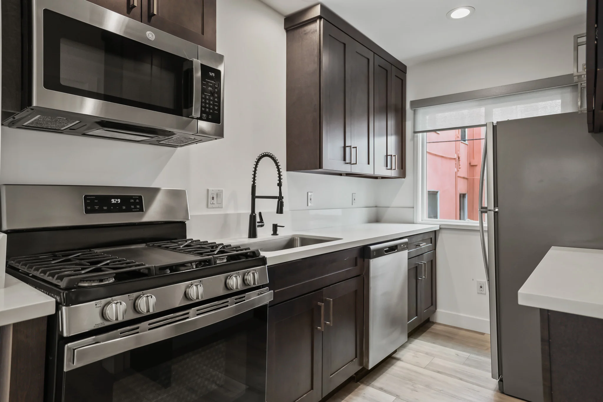 Modern kitchen featuring stainless steel appliances and granite countertops. (photo 1 of 19)
