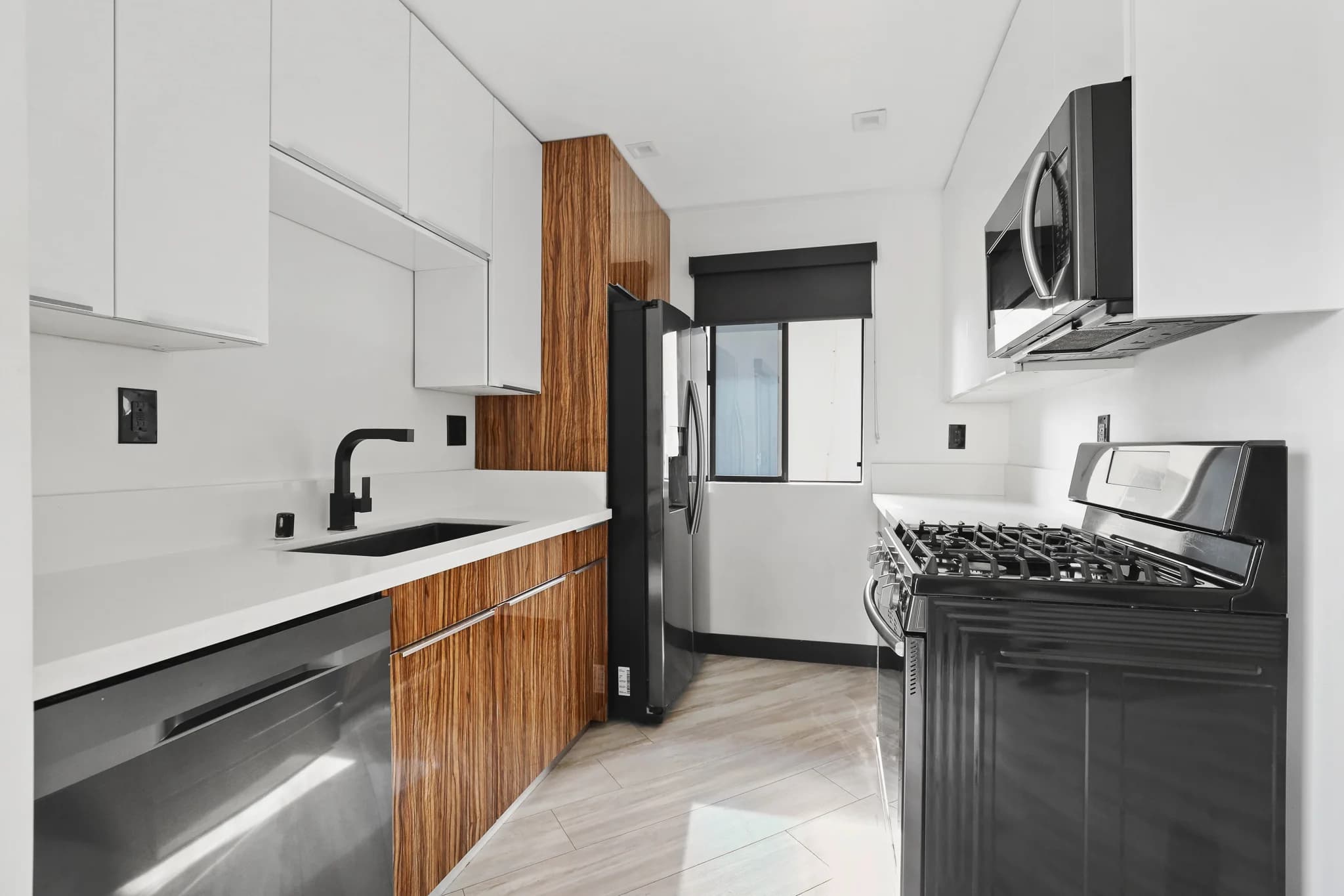 Modern kitchen with sleek cabinetry and stainless steel appliances. (photo 1 of 21)