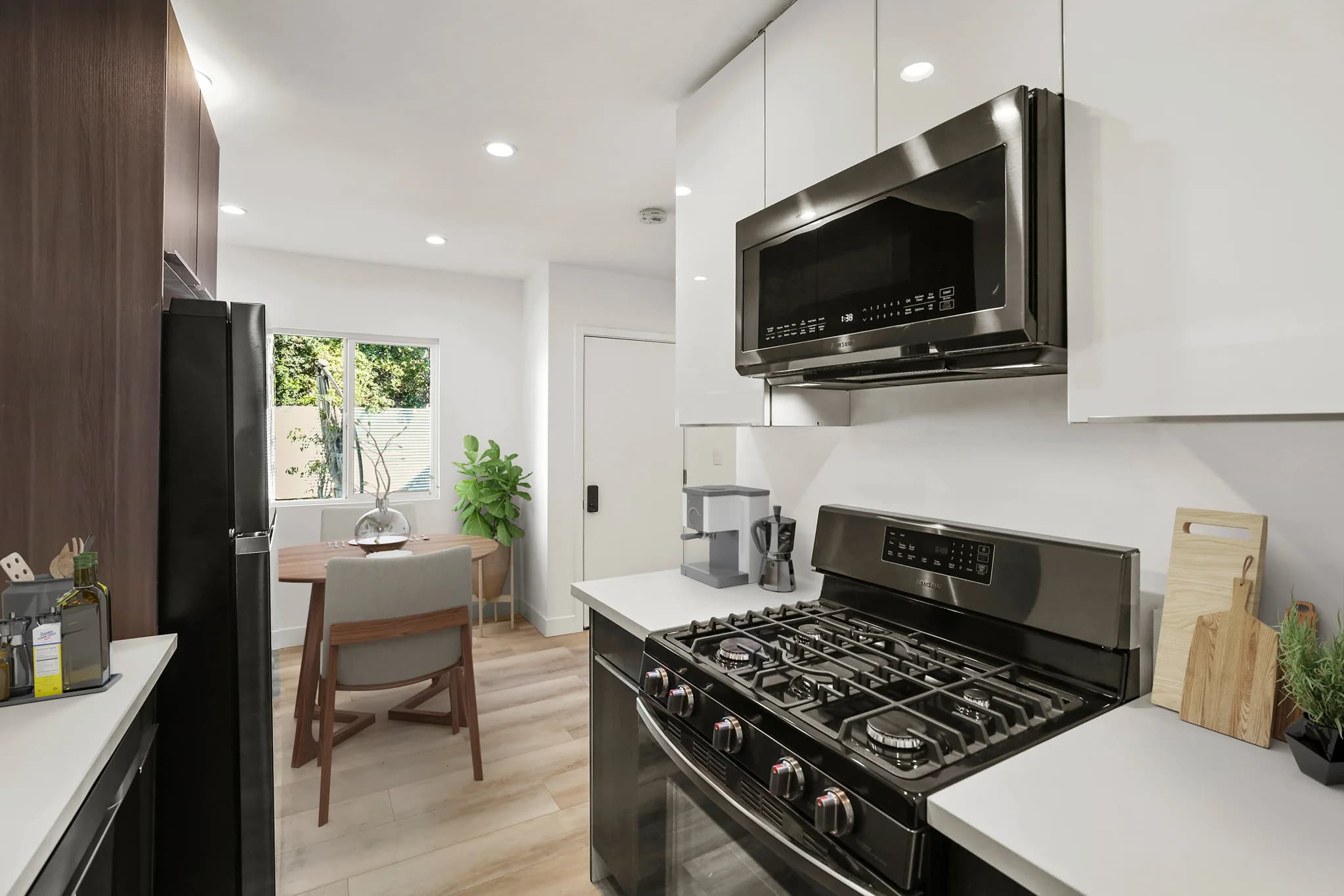 Modern kitchen with stainless steel appliances and granite countertops. (photo 1 of 20)