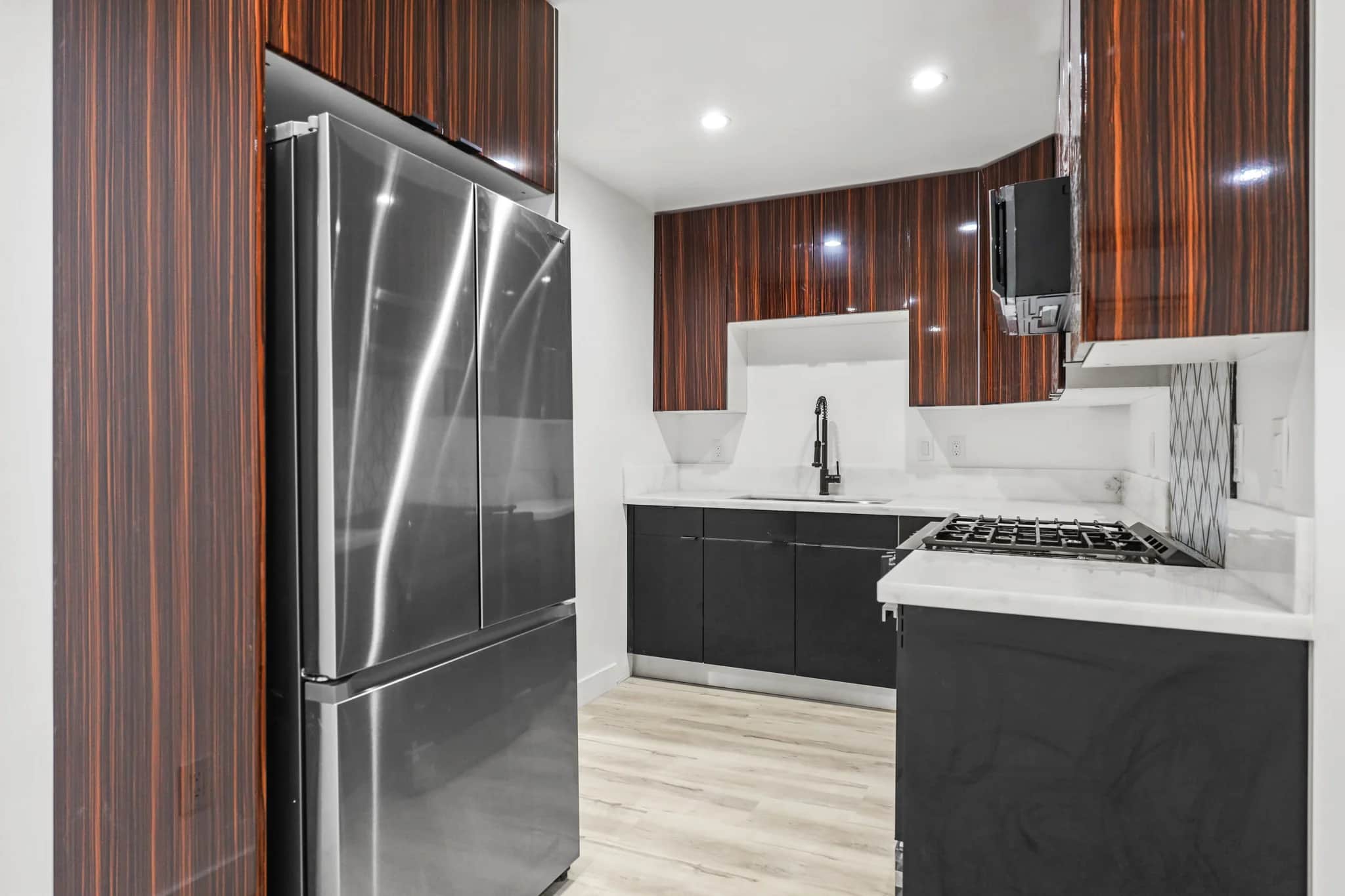 Modern kitchen featuring stainless steel appliances and granite countertops. (photo 1 of 25)