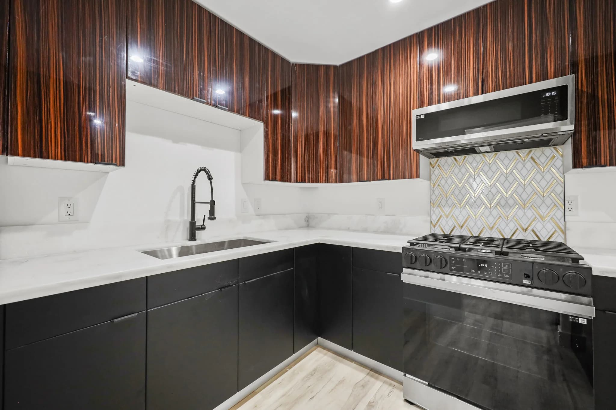 Modern kitchen featuring granite countertops and stainless steel appliances. (photo 2 of 25)