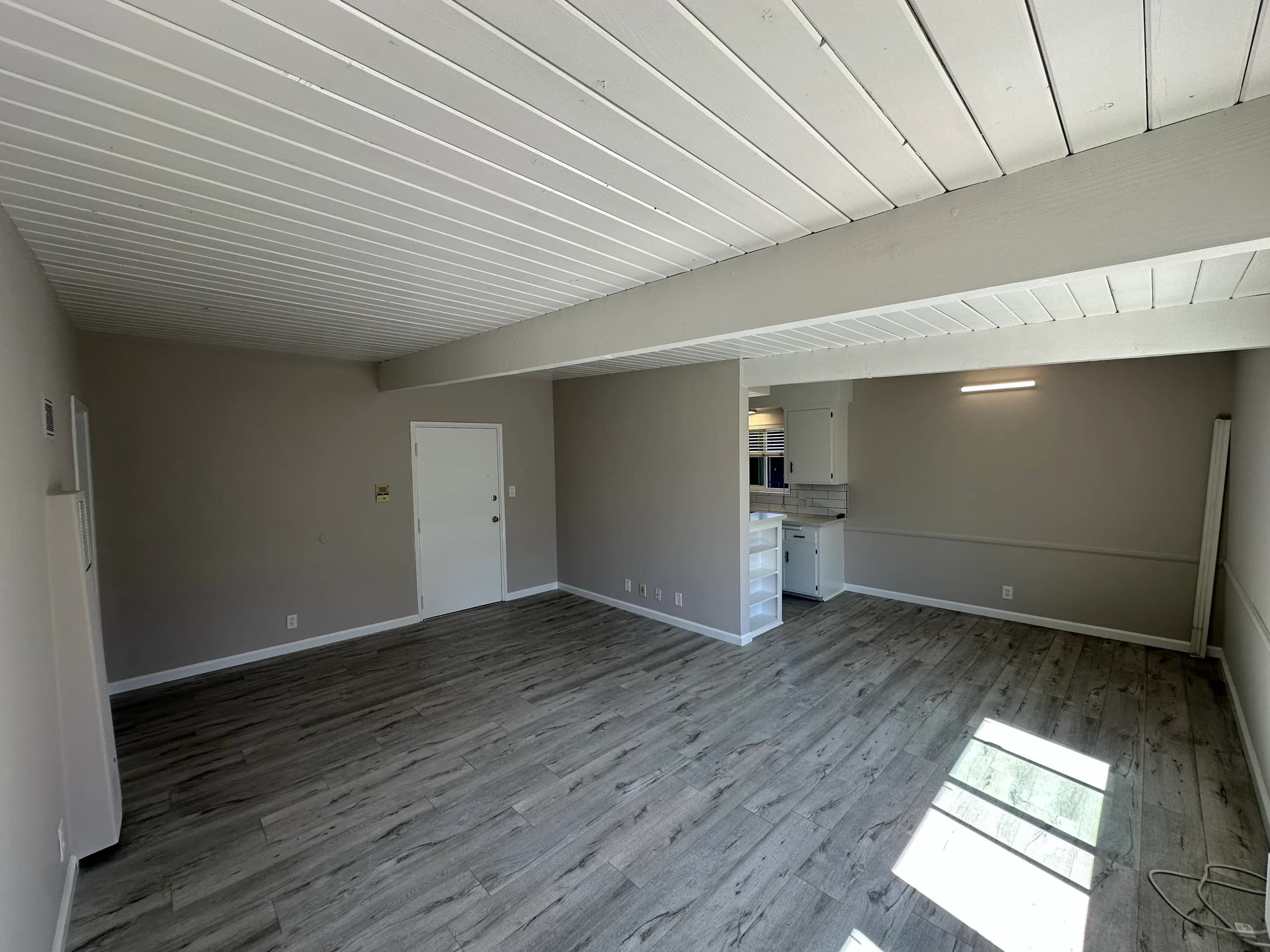 Spacious living room featuring hardwood flooring and an open layout. (photo 1 of 16)