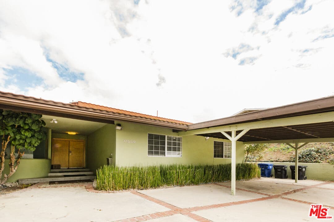 Front of the house w carport (photo 1 of 23)