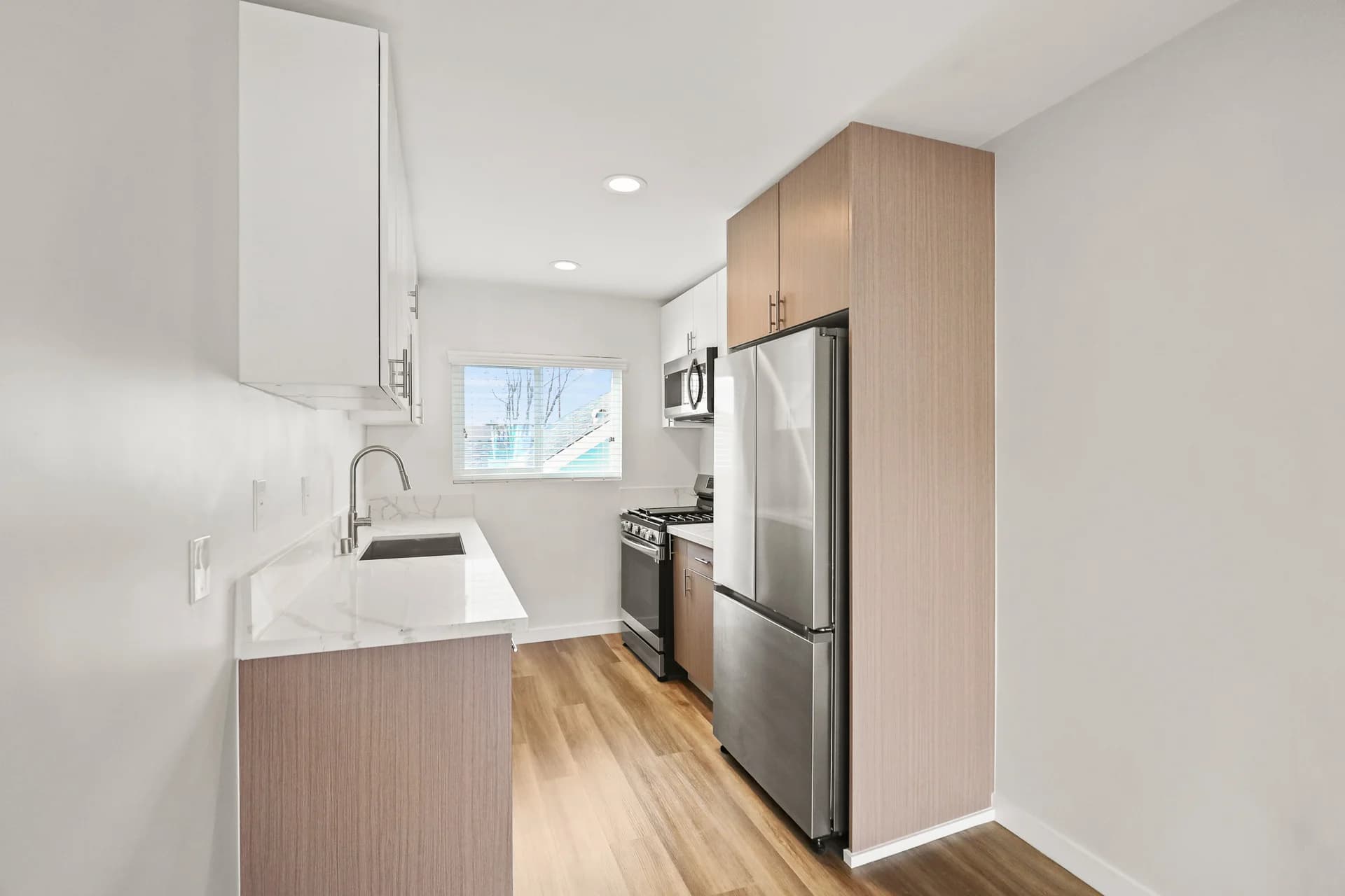 New Two Bedroom w/ All New Appliances | Modern Designer Cabinetry, Quartz Countertops, Stainless Steel Appliances, Refrigerator, Range w/ Oven, Microwave| Minutes to USC & Downtown Los Angeles | Re-Defining Modern Living — photo 1