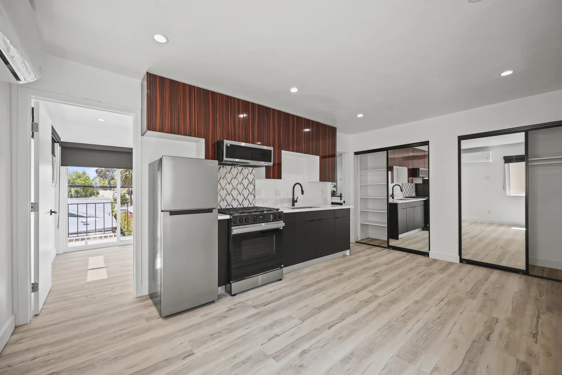 Modern kitchen with stainless appliances and granite countertops. (photo 2 of 20)