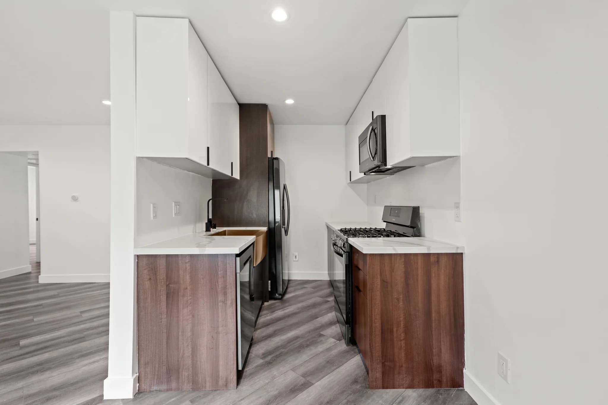 Modern kitchen featuring stainless appliances and granite countertops. (photo 2 of 25)