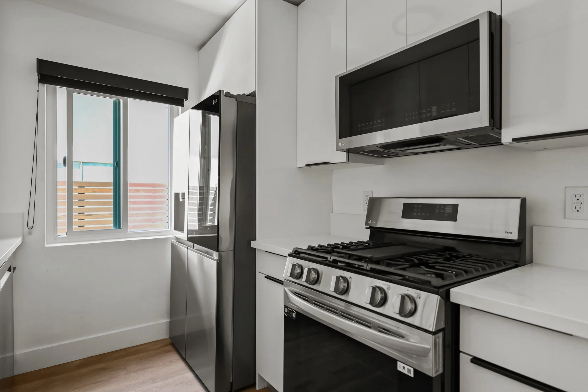 Modern kitchen featuring stainless steel appliances and granite countertops. (photo 2 of 22)