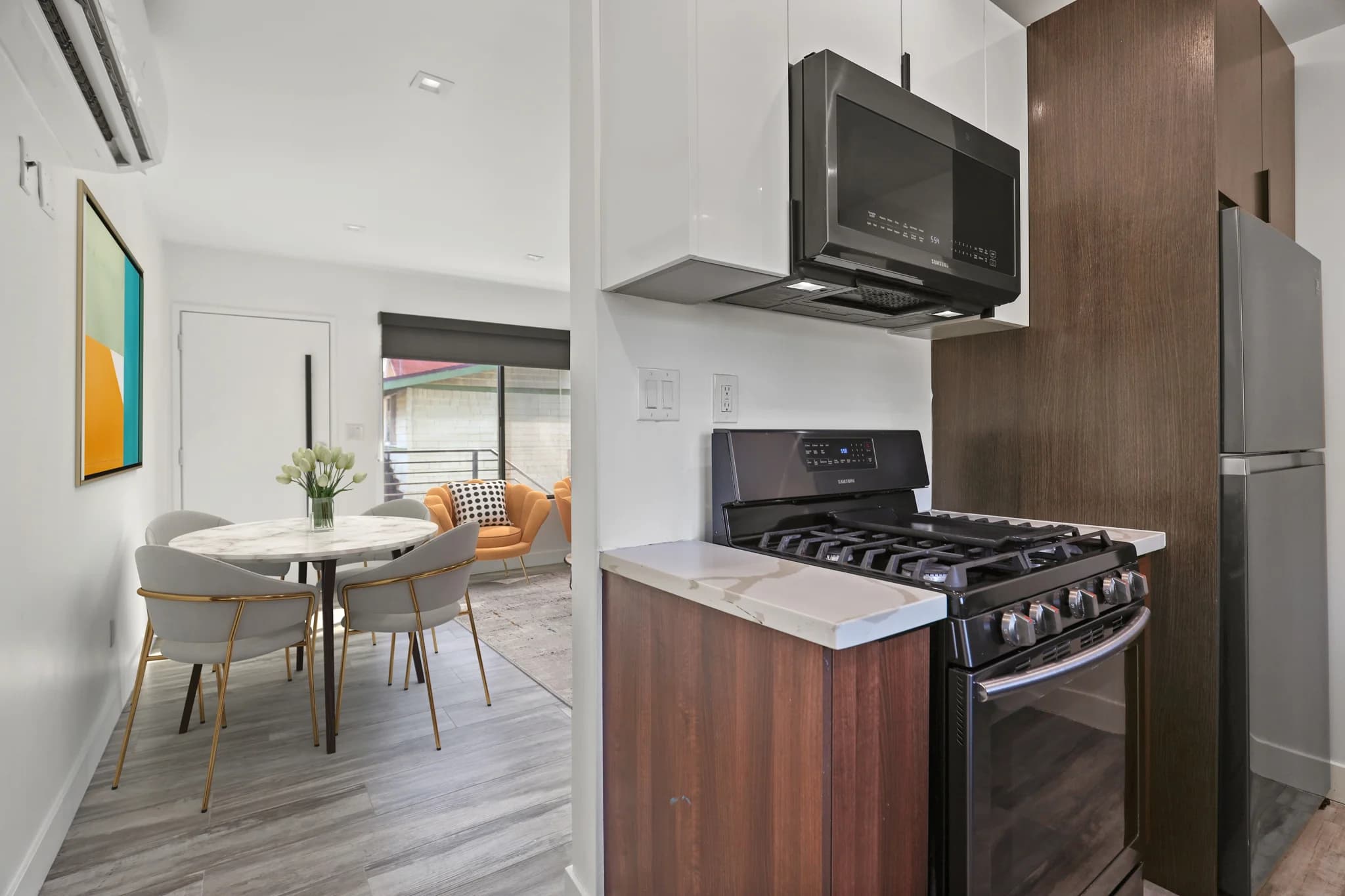 Modern kitchen with stainless steel appliances and granite countertops. (photo 2 of 23)