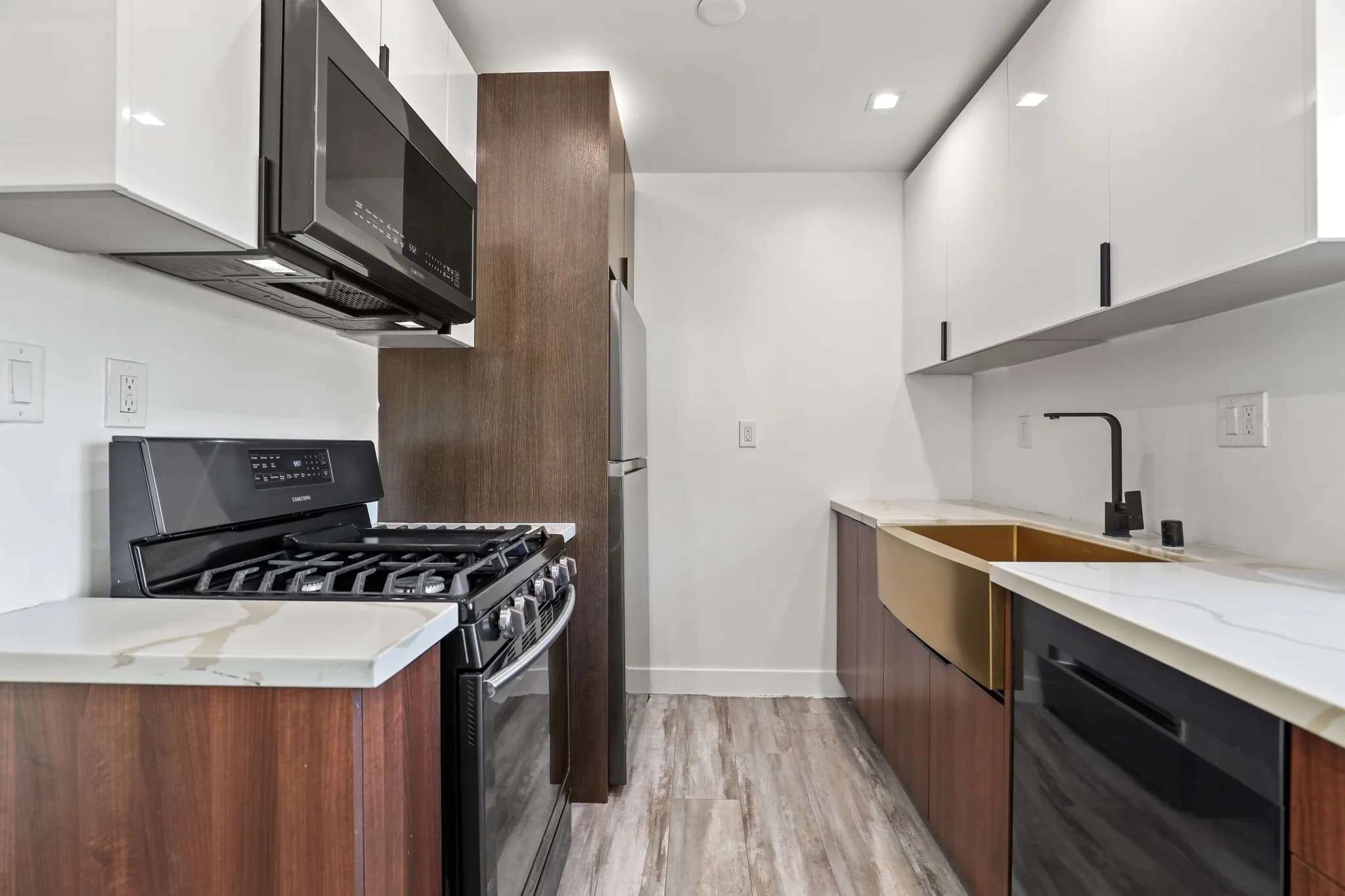 Modern kitchen with stainless steel appliances and granite countertops. (photo 1 of 23)