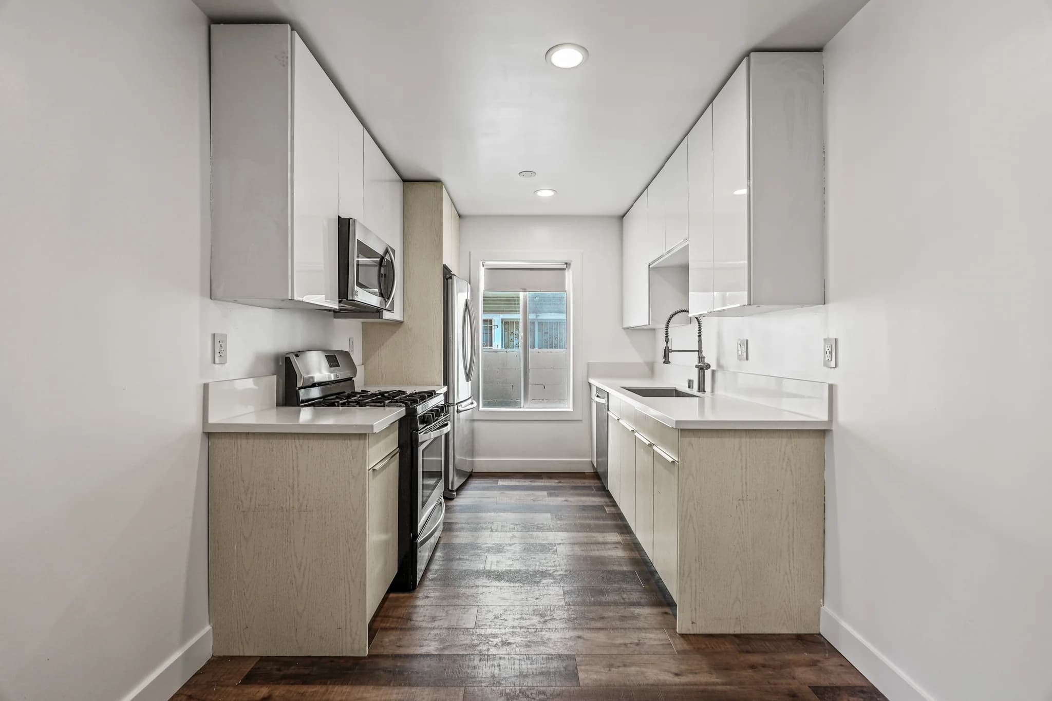 Modern kitchen featuring stainless appliances and granite countertops. (photo 2 of 20)